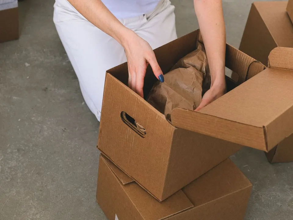 Carefully preparing belongings for a move